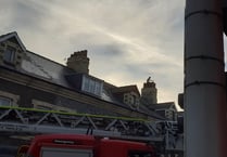 Road closed after concerned reports of person on roof 