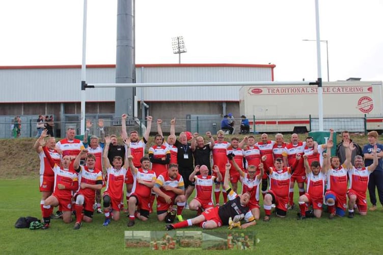 The Longlevens team celebrates their plate final win