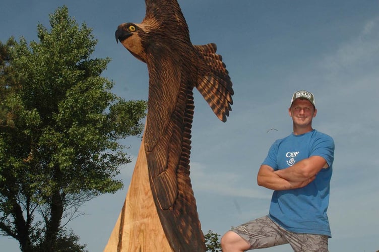 Tree sculptor Edward Parkes with the completed Osprey