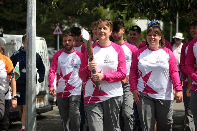 Anwen Butten carrying the Queen’s Baton in Aberystwyth 2022