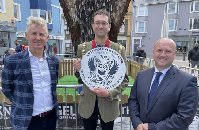 Clive Knowles of British Ironworks, and PCC Dafydd Llywelyn present Aberystwyth Mayor Dr Talat Chaudhri with the Anti Violence Charter