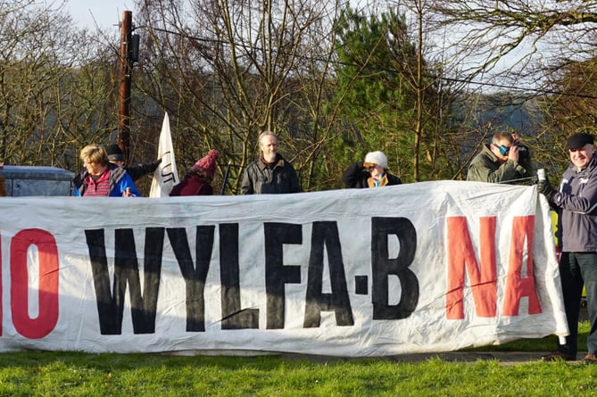 People Against Wylfa B protesters pictured campaigning by the suspension bridge at Menai Bridge