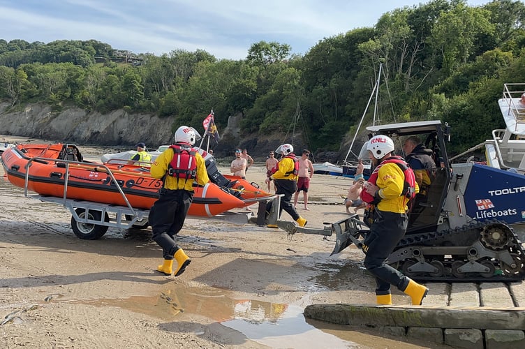 New Quay RNLI's inshore lifeboat launching on Sunday to paddleboaders in difficult