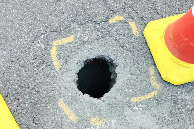 Hole in road in Llanbedr