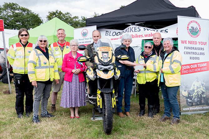 Lampeter Show 2019 committee members present a cheque to local Blood Bikes Wales volunteers