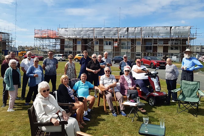 Residents have been hit by storm and rain damage as well as the threat of a new housing development on their green space