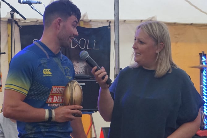 Player of the Tournament, Dafydd Llewelyn of Aberaeron, receiving his trophy from Nia Wyn Jones, sister of the late Sion Wyn 