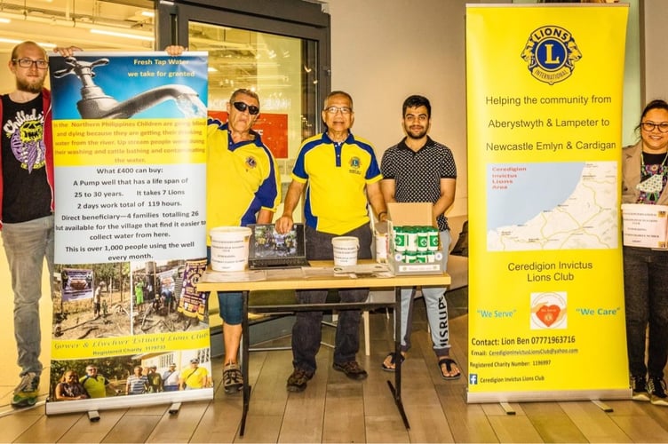 Ceredigion Invictus Lions Club members during their fundraising activity in Aberystwyth