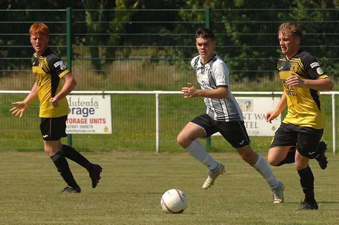 Dolgellau saw off the challenge of Welshpool Town with a 3-0 victory at the Marian