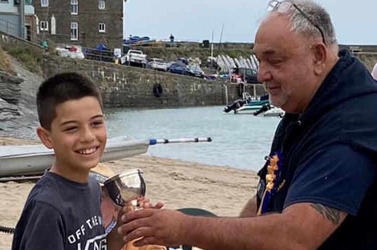 President Daniel Potter presenting Isaac Noormohamed with the Glyn Vaughan Rose Bowl, New Quay Regatta, 2022