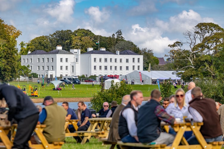 Visitors enjoying the sunshine at The GWCT Welsh Game Fair at Vaynol Hall