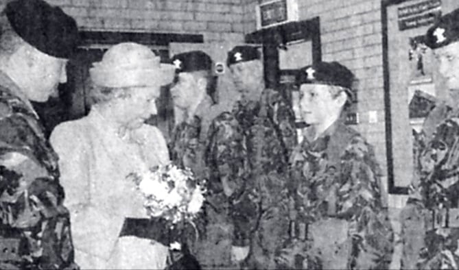 Second Lieutenant Andrew Davies introduces the Queen to Dyfed cadets at her unveiling of a plaque at the Aberystwyth Territorial Army Centre