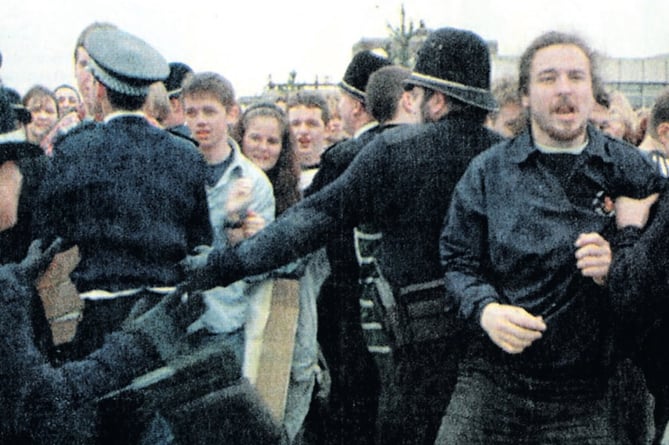 Iestyn Evans, front right, being grabbed by a police officer as protesters made their opposition to the Queen’s visit known