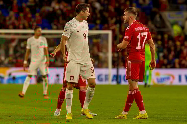 Aberystwyth’s Rhys Norrington-Davies shares a few words with Polish legend Robert Lewandowski during Cymru’s 1-0 defeat on Sunday
Nations League 260922