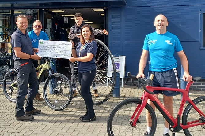 Picture at the cheque presentation are Afan managing director Andrew Davies, mechanic Jon Burr, salesperson and mechanic Matthew Milican, Hywel Dda Health Charities fundraising officer Bridget Harpwood and salesperson Stuart Hickman