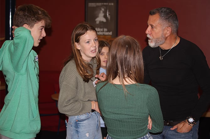 Julian Evans with members of the Dragon Theatre Drama Club