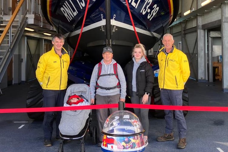 From left: Pwllheli RNLI mechanic Alwyn Roberts, Nigel’s grandson Hunter-Ross, Nigel Davies, Nigel’s daughter, Lauren and Pwllheli RNLI lifeboat operations manager Andy Vowell