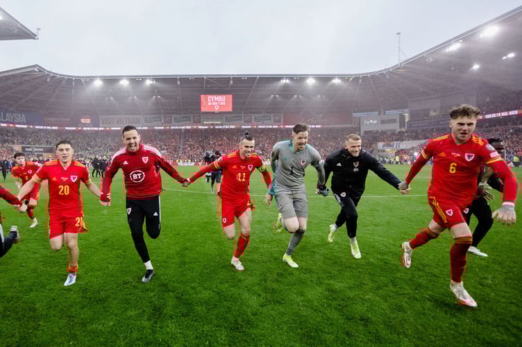 CARDIFF, WALES - 05 JUNE 2022: Wales' Gareth Bale and Wales celebrate after beating Ukraine 1-0 to book a place at the 2022 FIFA World Cup at the Cardiff City Stadium on the 5th of June 2022. (Pic by John Smith/FAW)