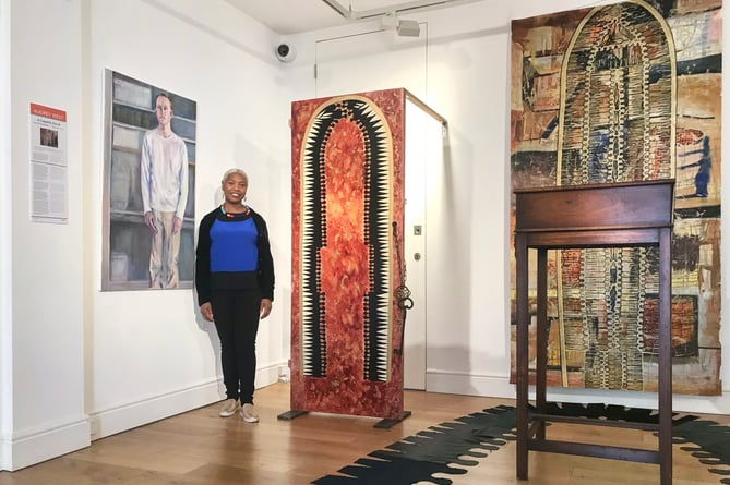 Audrey West in her exhibition, ‘A Cappella Storiel: Redemption Songs’