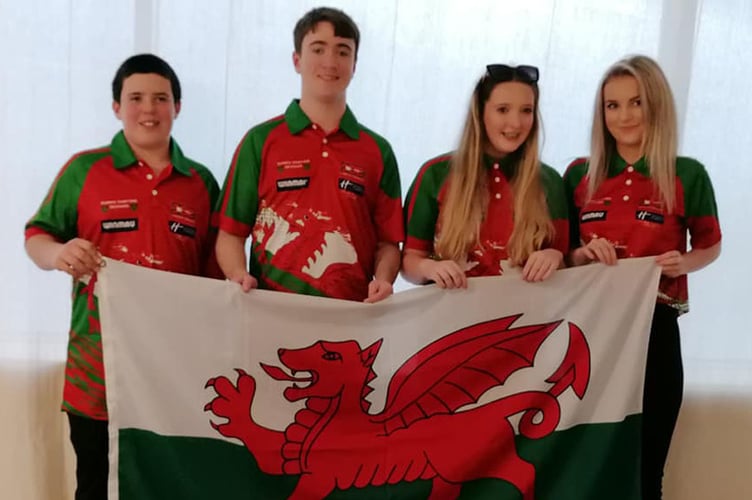 Junior Ceredigion darts players Sion Davies, Oliver Thomas, Llinos Thomas and Elonwy Thomas