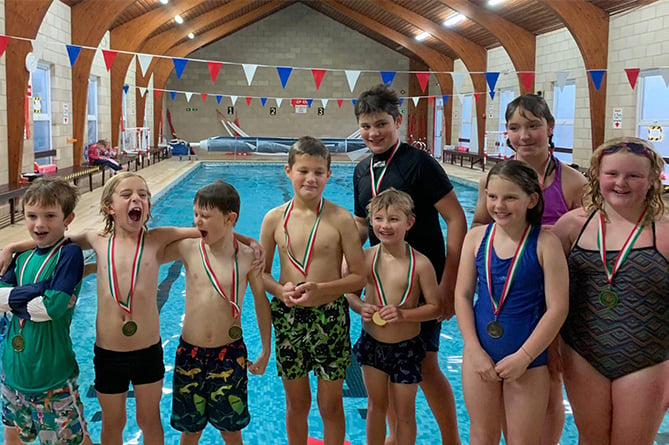 The children who swam over 11km to raise money for their friend Julia and Aberaeron Swimming Pool