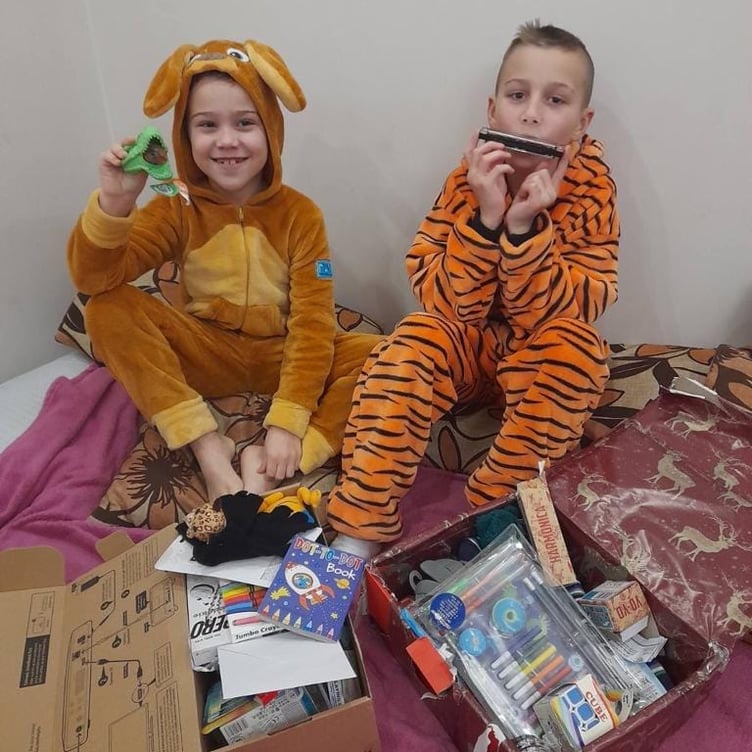 Children in Ukraine opening their presents from Penparcau