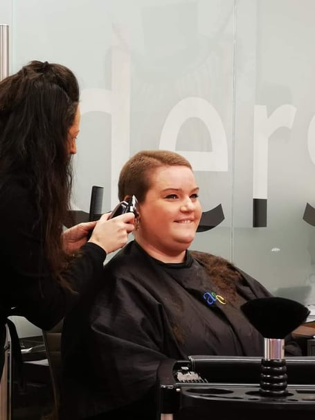 Rachel Davies being shaved by Jacquie McCartney of Jago Hair Salon, Aberystwyth.