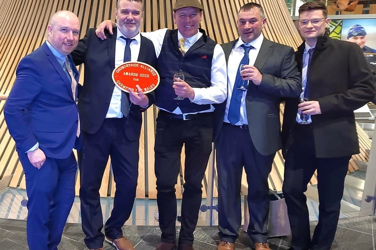 MS Mabon ap Gwynfor, celebrity farmer Gareth Wyn Jones (centre) and the team from Y Madryn Arms
