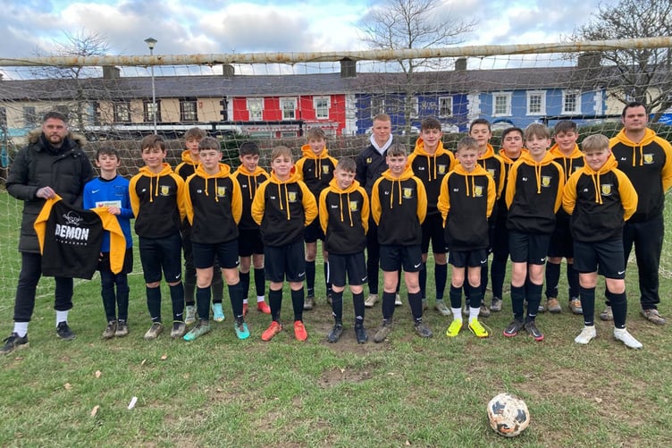 Aberaeron FC Under 14 in new hoodies sponsored by Demon Barbers