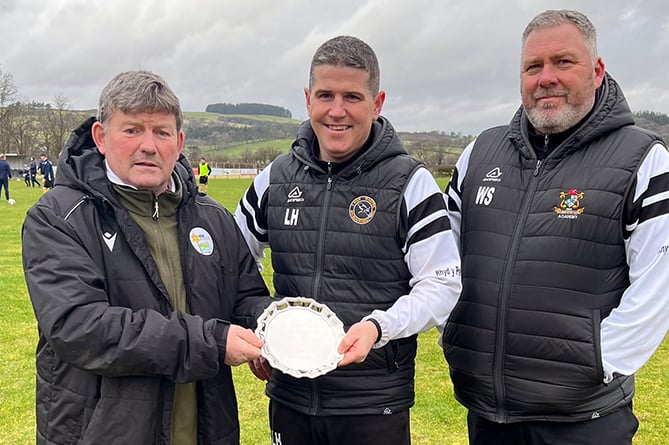 Bow Street boss Llyr Hughes accepts the award