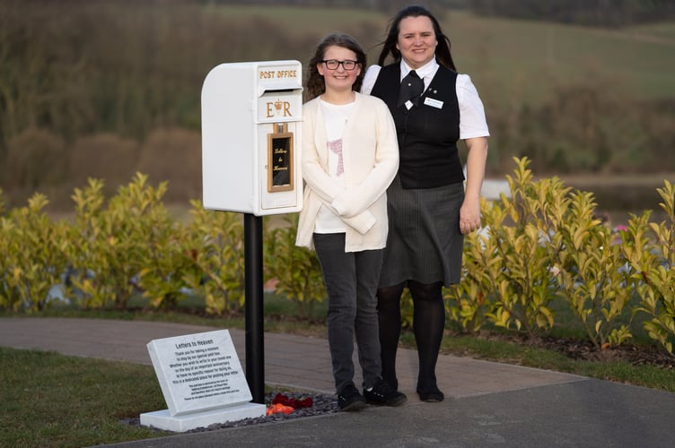 Matilda Handy, 9, and mum, Leanne Handy 45 with their letter box to heaven, in Gedling Crematorium, which allows grieving members of the public to write a letter to their loved ones who have passed away. A nine-year-old girl's 'postbox to heaven' idea which allows people to send letters to their deceased loved ones is to be rolled out nationally at crematoriums across the UK. See SWNS story SWLNpost. Grieving Matilda Handy suggested the heartwarming idea while looking for a way to express her emotions after her grandparents passed away. The schoolgirl wanted to send her late grandma/nan/gran and granddad letters and cards so her family approached Gedling Crematorium, in Lambley, Nottingham. Crematorium bosses responded by installing an old Royal Mail postbox painted white just before Christmas, which led to more than 100 letters being posted. The postboxes are now set to be implemented at more than 40 other sites across the country after Matilda's moving tribute to her grandparents proved so popular.