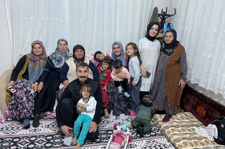Mahmut’s family members pictured in this photo are now homeless.