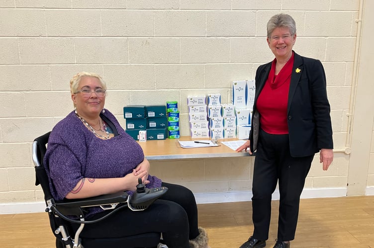 Minister for Social Justice, Jane Hutt and Dee Dickens who has campaigned for period dignity, at Glyncoch Community Centre, with free period products available to those who need them