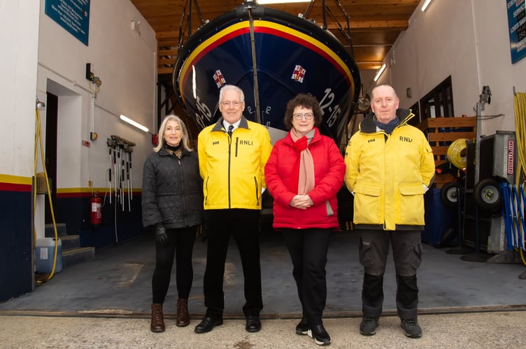 Elin Jones MS (centre) with Liz Singer (fundraising appeal), Roger Couch New Quay RNLI Lifeboat Operations Manager and Bernie Davies, Station Mechanic (L-R)