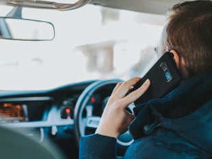 Ban for driving while using mobile phone escaped