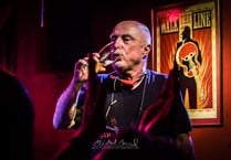 Punk poet Attila the Stockbroker in night at the museum