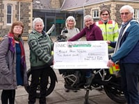 Carol singers raise £1,100 for good causes