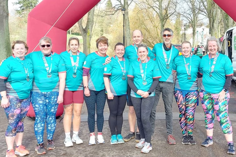 Aber runners celebrate with their medals at the Shrewsbury 10k