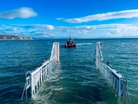 Two rescued after jet ski starts to sink