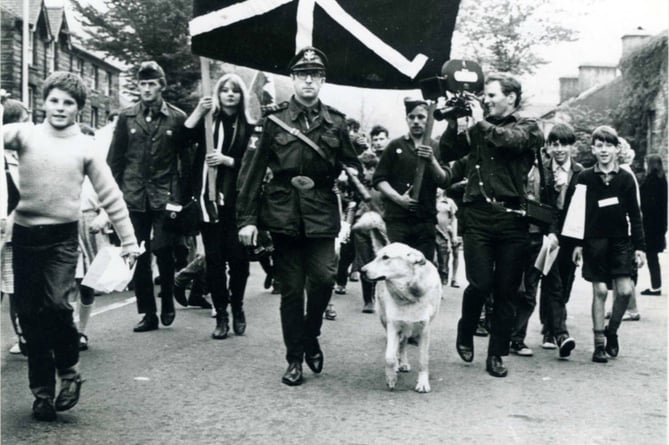 Dennis Coslett and Gelert the dog, leading an FWA march in Machynlleth