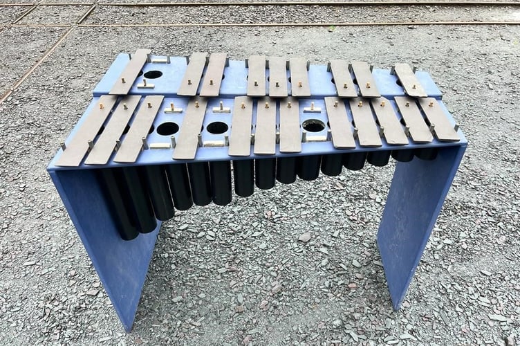 A slate xylophone is one of the instruments that will be used to play a new piece of music composed to celebrate the slate quarries of Gwynedd being granted World Heritage Status