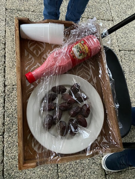 Worshippers break their fast with dates before evening prayers at the Mubarak Mosque in Tilford, followed by an Iftar evening meal
