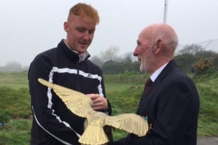 Cilgwyn GC Bryn Thomas receives the prestigious golden eagle trophy