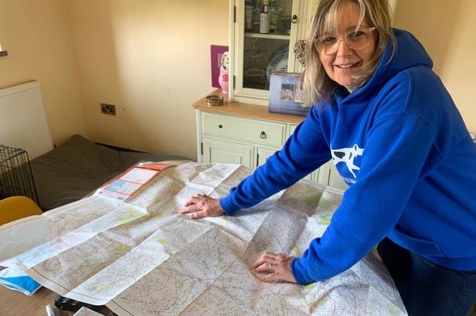 Suzanne looking at where her farm lies in relation to an alleged corridor of big cat activity