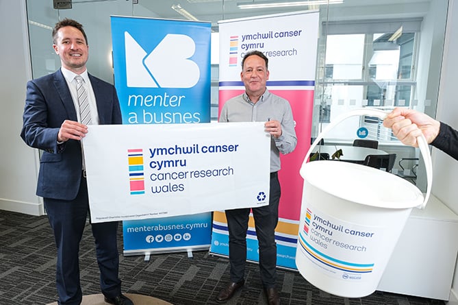 Llŷr Roberts, Menter a Busnes CEO with Kieran Roberts, chief executive of Cancer Research Wales