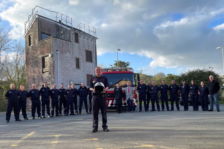 Mike Evans is pictured with colleagues outside Pwllheli Fire Station