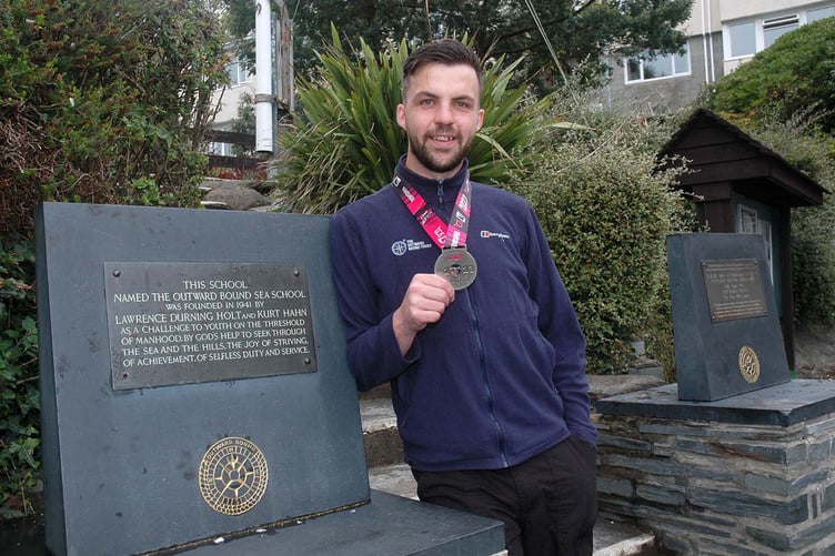 Dave Jenkins with his London Marathon medal at the Aberdyfi Outward Bound Centre where he works