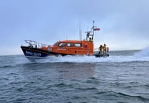 RNLI rescue three people and a dog