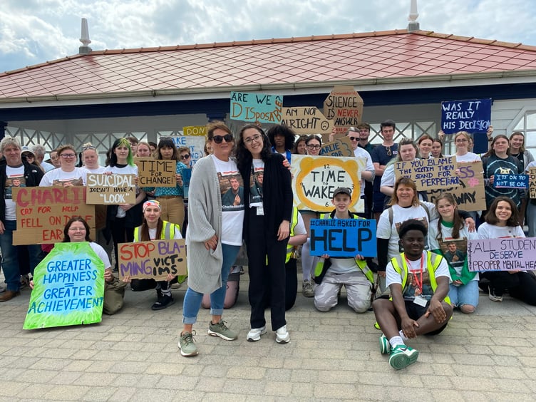 Charlie's girlfriend Romana Nemcova (right) and his mum Emma Laney supported by nearly 100 students