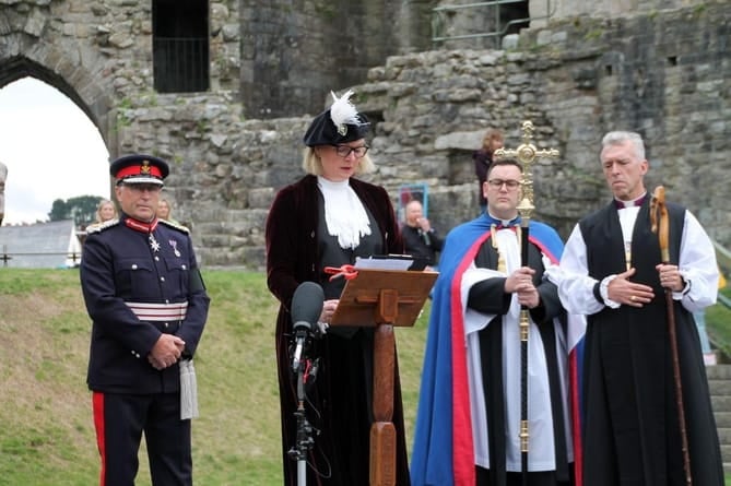 The proclamation of the King at Caernarfon last September was made in English by the High Sheriff of Gwynedd, Davina Carey-Evans, and in Welsh by the Under Sheriff, Dr John Gwilym Owen